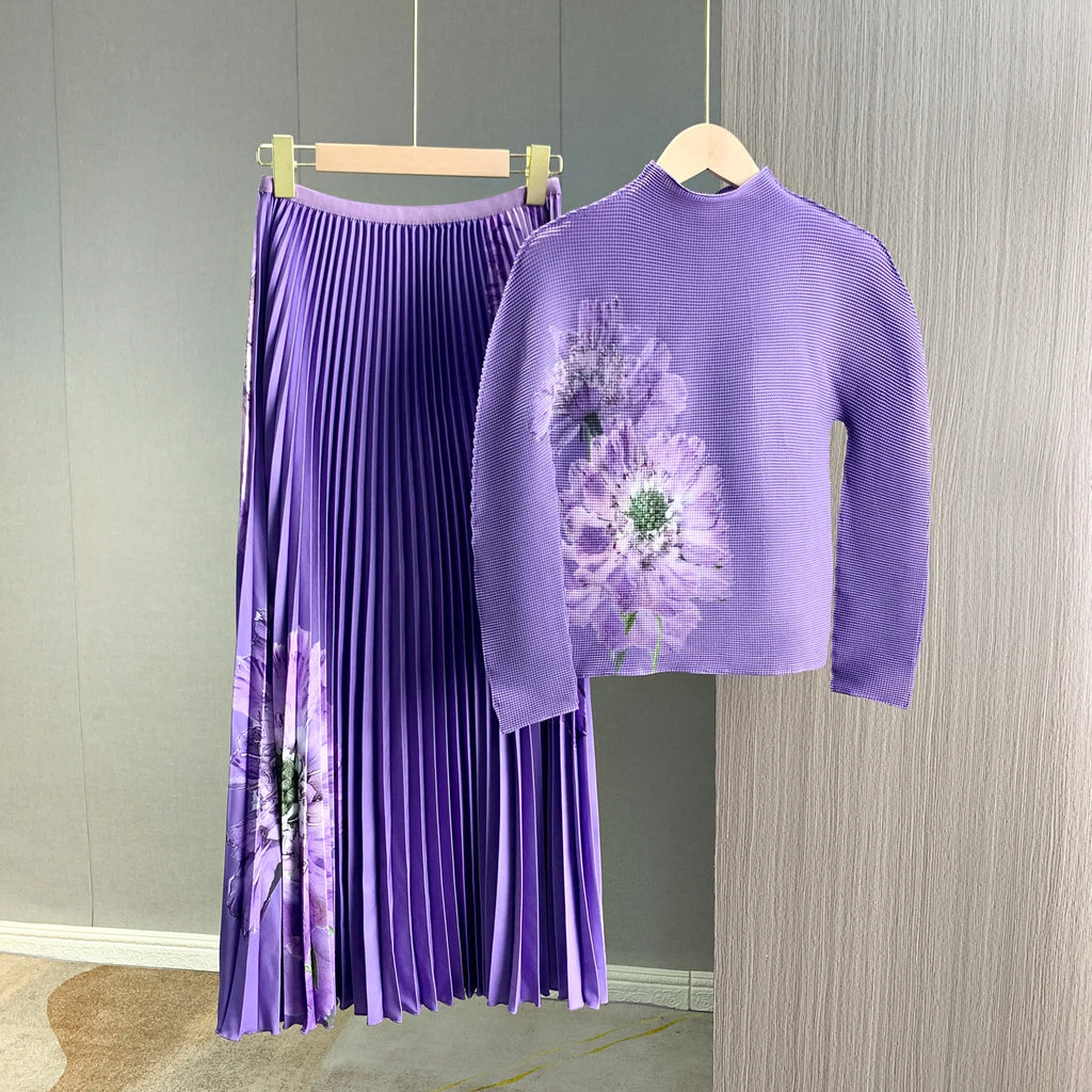 A complete outfit for women, including a long-sleeved t-shirt and a printed pleated skirt – a two-piece set.