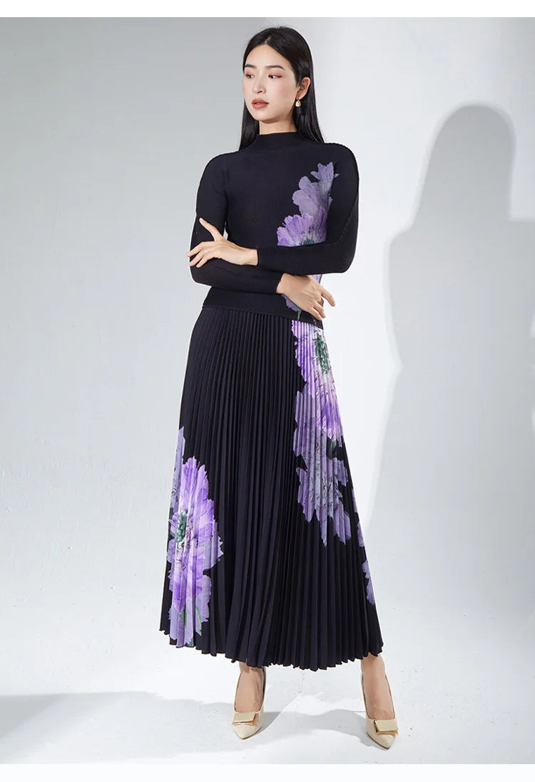 A complete outfit for women, including a long-sleeved t-shirt and a printed pleated skirt – a two-piece set.
